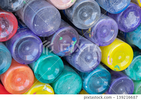 Colorful paint jars stacked in a close-up composition. Abstract art Colorful paint jars stacked in a close-up composition. Abstract art 139216687