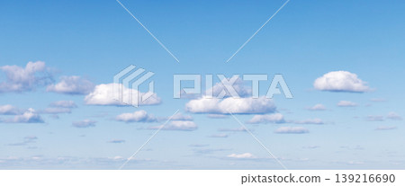 White altocumulus clouds are in blue sky on a daytime, natural panoramic background 139216690