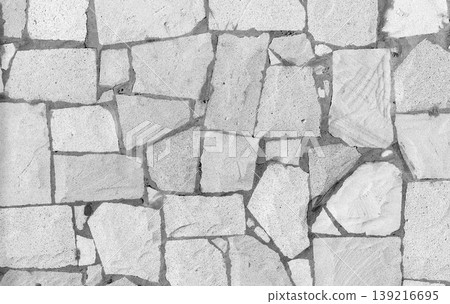 A high-resolution image of a seamless textured stone wall 139216695