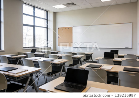 Modern empty classroom with laptops and whiteboard ready for learning and teaching Modern empty classroom with laptops and whiteboard ready for learning and teaching 139216997
