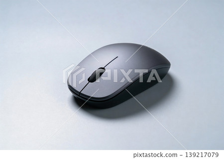 Modern wireless computer mouse with scroll wheel on a clean, minimalist background Modern wireless computer mouse with scroll wheel on a clean, minimalist background 139217079