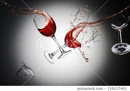 Shattered Red Wine Glasses with Splattering Drops and Fragments Shattered Red Wine Glasses with Splattering Drops and Fragments 139217401