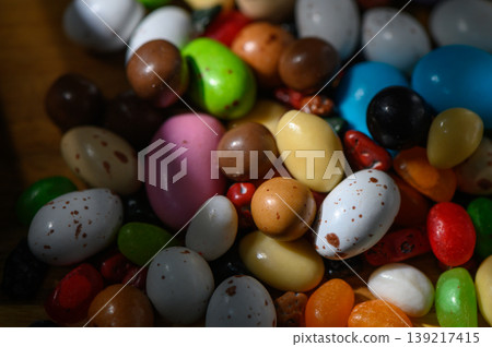Colorful assortment of candy beans sprinkled with sunlight in a playful display Colorful assortment of candy beans sprinkled with sunlight in a playful display 139217415