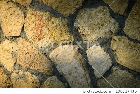 Stone Wall Background with Rays of Sunlight Stone Wall Background with Rays of Sunlight 139217439