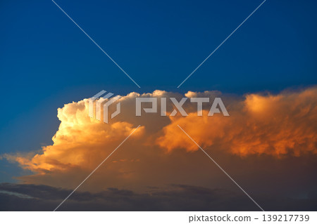 Sunset sky orange clouds on blue Sunset sky orange clouds on blue 139217739