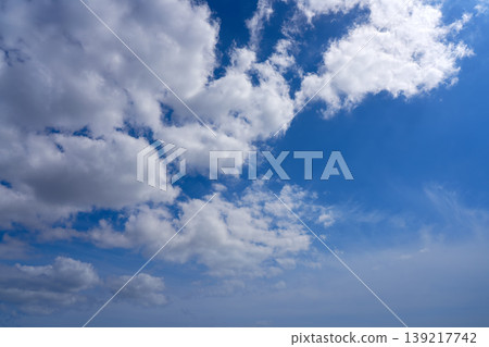 Blue sky white summer cumulus clouds Blue sky white summer cumulus clouds 139217742