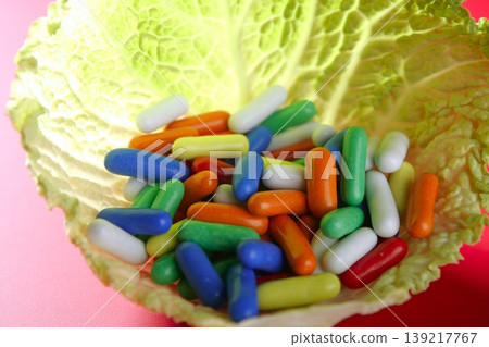 colorful candy on vivid red background colorful candy on vivid red background 139217767