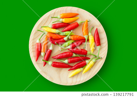 colorful chili peppers plate isolated colorful chili peppers plate isolated 139217791