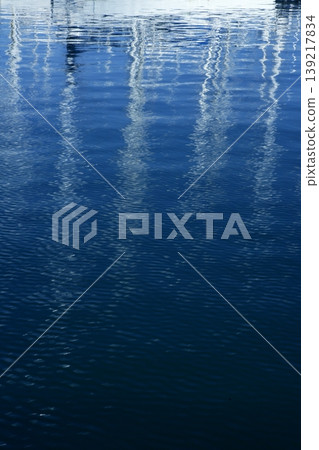 Sailboat blurred mast reflexion on the marina Sailboat blurred mast reflexion on the marina 139217834