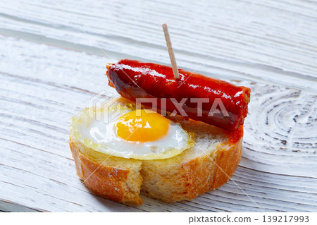 pinchos pintxos chistorra with quail egg tapas pinchos pintxos chistorra with quail egg tapas 139217993