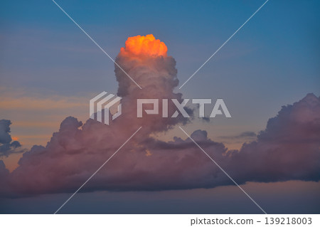 Sunset sky orange clouds on blue Sunset sky orange clouds on blue 139218003