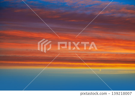 Sunset clouds sky in orange and blue Sunset clouds sky in orange and blue 139218007