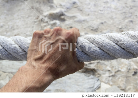 man hand grab grip strong big aged rope man hand grab grip strong big aged rope 139218117