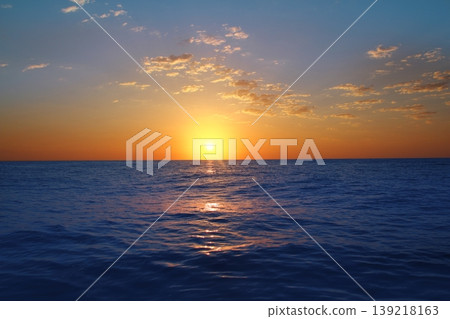 Sunrise sunset in ocean blue sea glowing sun 139218163