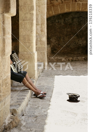 Beggar hidden accordion musician with hat Beggar hidden accordion musician with hat 139218339