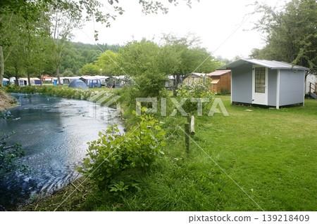 Camping forest meadow in the river shore Camping forest meadow in the river shore 139218409