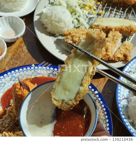 delicious crispy golden fried pork cutlet with melted mozzarella cheese delicious crispy golden fried pork cutlet with melted mozzarella cheese 139218436