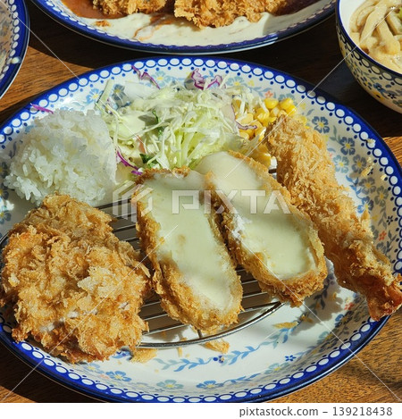 delicious crispy golden fried pork cutlet with melted mozzarella cheese delicious crispy golden fried pork cutlet with melted mozzarella cheese 139218438