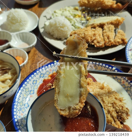 delicious crispy golden fried pork cutlet with melted mozzarella cheese 139218439