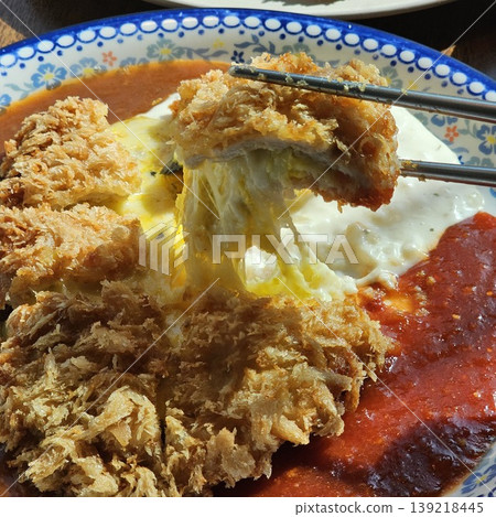 delicious crispy golden fried pork cutlet with melted mozzarella cheese 139218445
