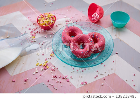 Kids party with milk pink donas and cupcake topings 139218483