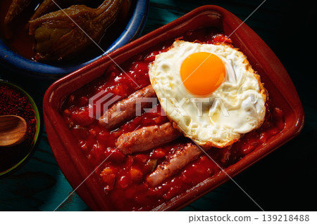 Tapas pisto con tomate ratatouille sausage egg Tapas pisto con tomate ratatouille sausage egg 139218488