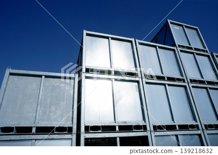Containers stacked in silver rows over blue  sky 139218632