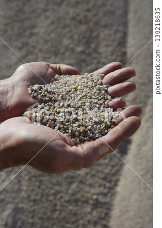 gravel sand in man hands in quarry showing camera gravel sand in man hands in quarry showing camera 139218635