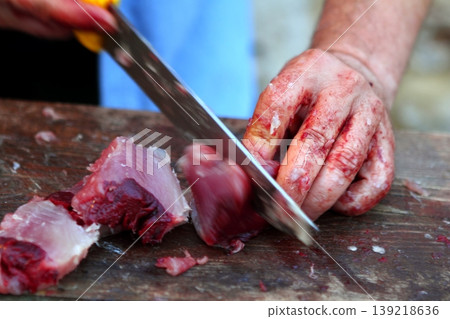 active fishmonger hand cutting tuna fish knife active fishmonger hand cutting tuna fish knife 139218636