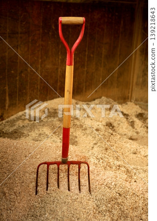 Horse stable witth straw fork tool, sawdust. Horse stable witth straw fork tool, sawdust. 139218643