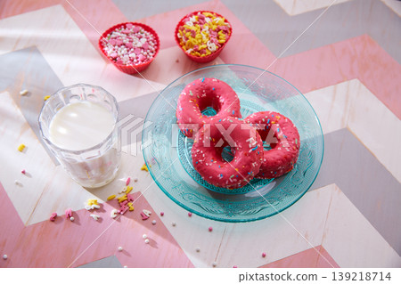 Kids party with milk pink donas and cupcake topings Kids party with milk pink donas and cupcake topings 139218714