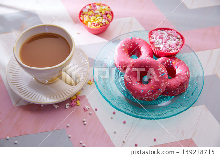 Tea with milk breakfast with pink donas Tea with milk breakfast with pink donas 139218715