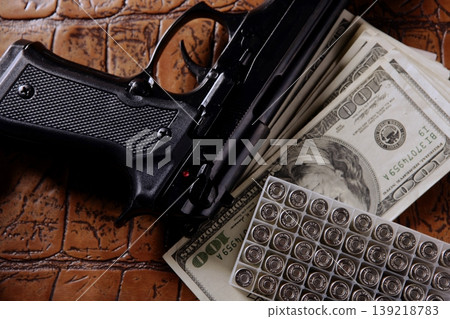 Dollar notes and gun, black pistol 139218783