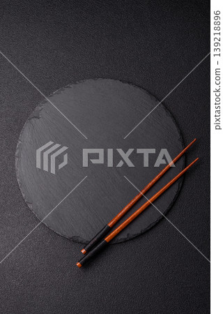 Empty slate board with wooden chopsticks for Asian food. Empty slate board Empty slate board with wooden chopsticks for Asian food. Empty slate board 139218896
