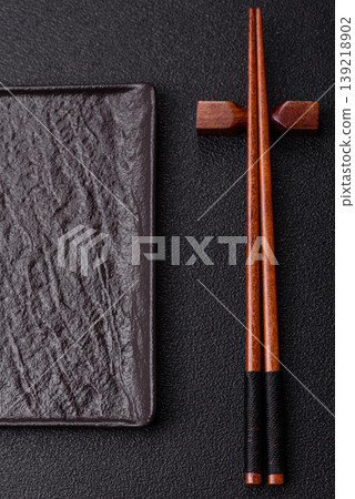 Empty slate board with wooden chopsticks for Asian food. Empty slate board Empty slate board with wooden chopsticks for Asian food. Empty slate board 139218902