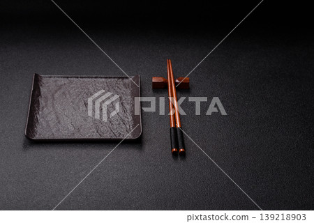 Empty slate board with wooden chopsticks for Asian food. Empty slate board 139218903