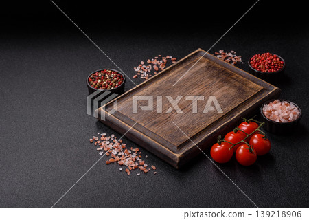 An empty wooden cutting board, kitchen utensils for food preparation. An empty cutting board 139218906