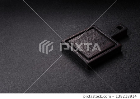An empty wooden cutting board, kitchen utensils for food preparation. An empty cutting board 139218914
