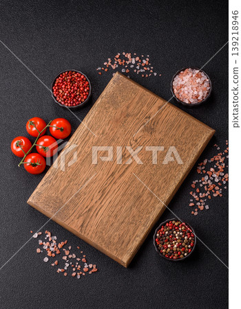 An empty wooden cutting board, kitchen utensils for food preparation. An empty cutting board An empty wooden cutting board, kitchen utensils for food preparation. An empty cutting board 139218946
