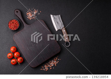 An empty wooden cutting board, kitchen utensils for food preparation. An empty cutting board 139218954