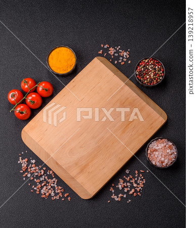 An empty wooden cutting board, kitchen utensils for food preparation. An empty cutting board An empty wooden cutting board, kitchen utensils for food preparation. An empty cutting board 139218957