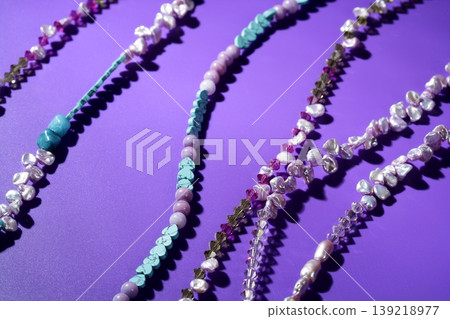 Color stones jewelry necklaces, purple background Color stones jewelry necklaces, purple background 139218977