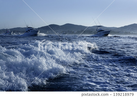 Fishing boat in a big game summer blue morning Fishing boat in a big game summer blue morning 139218979