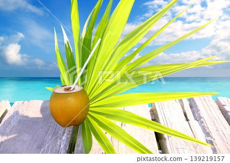 coconut fresh in caribbean sea pier chit palm leaf coconut fresh in caribbean sea pier chit palm leaf 139219157
