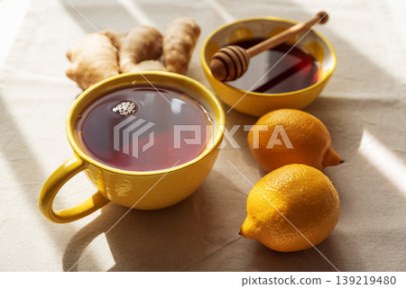 Flat Lay with Lemon Tea, Ginger and Honey on Light Table Flat Lay with Lemon Tea, Ginger and Honey on Light Table 139219480