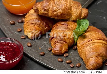 Baked croissant on black board, delicious breakfast, Baked croissant on black board, delicious breakfast, 139219608