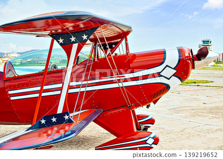 Airplane, red light aerobatic biplane. Air shows 139219652