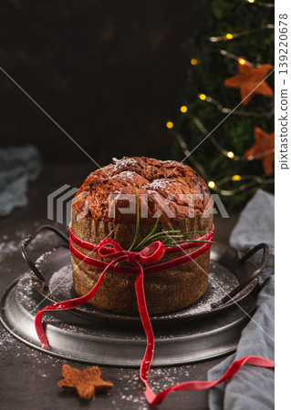 Traditional Panettone with Red Velvet Ribbon and Decor 139220678