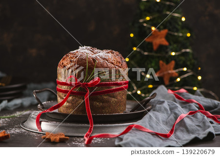 Festive Panettone with Christmas Tree Background Festive Panettone with Christmas Tree Background 139220679