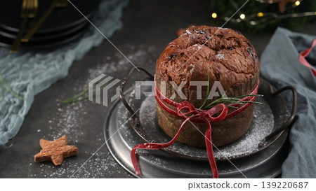 Homemade Panettone Cake with Red Ribbon for Holiday Celebration Homemade Panettone Cake with Red Ribbon for Holiday Celebration 139220687